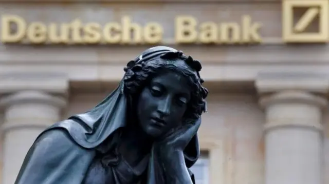 Deutsche Bank logo and statue