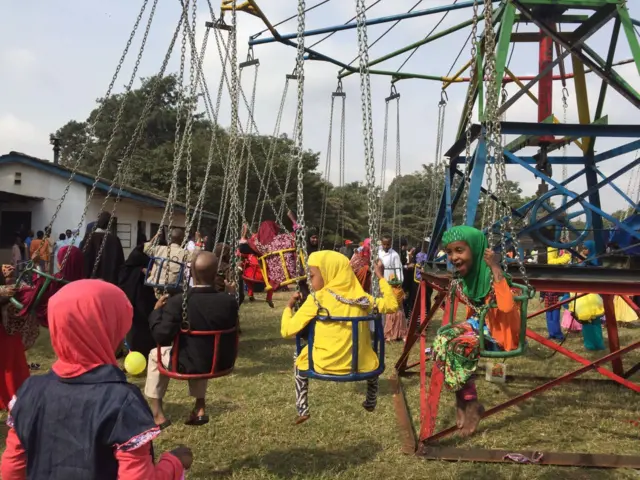 Children on swings in Eastleigh, Nairobi, Kenya