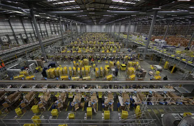 Parcels are prepared for dispatch at Amazon's warehouse