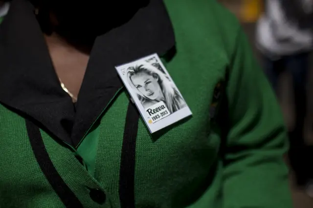 A member of the ANC Women's league wears a pin for Reeva Steenkamp in Pretoria in 2014