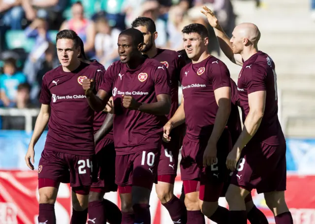 Hearts players celebrate the first goal