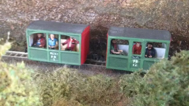 Models in small "bug boxes" from the Ffestiniog Railway in Wales