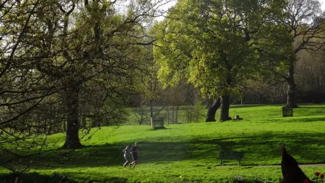 Two runners on the path at the Joey the Swan recreation ground in Wistaston