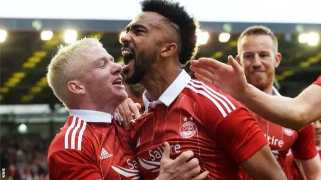 Shay Logan celebrates his opening goal in Aberdeen's 3-1 first leg win