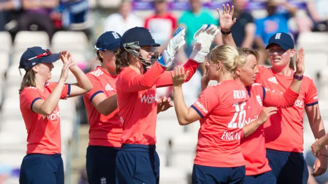 England's women celebrate beating Pakistan