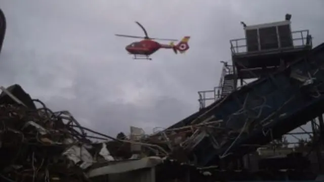 Air ambulance flying over Nechells recycling yard