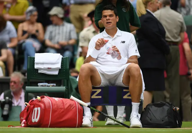 Milos Raonic of Canada looks on