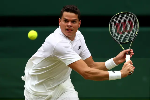 Milos Raonic plays a shot