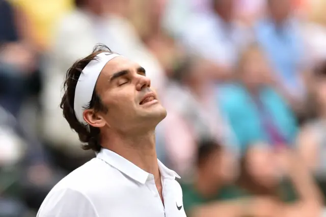 Roger Federer reacts to a missed shot