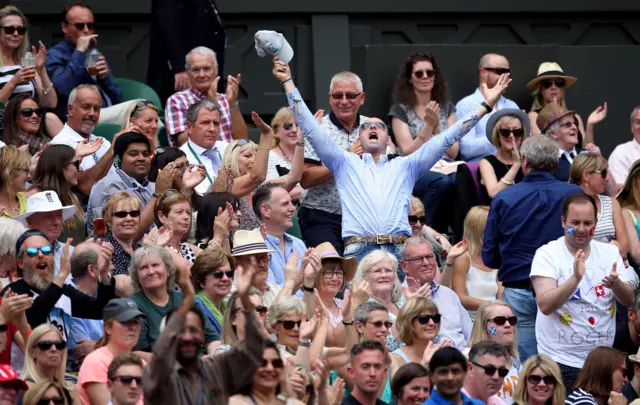 Spectators celebrate on Centre Court