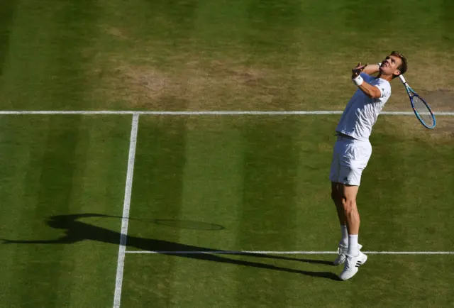 Tomas Berdych serves