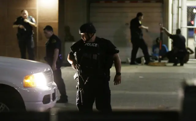 Dallas police detain a driver