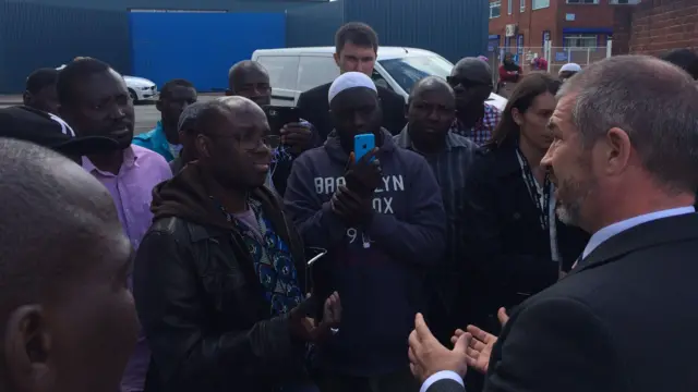 Police speaking to media and family members outside the metal recycling plant in Nechells