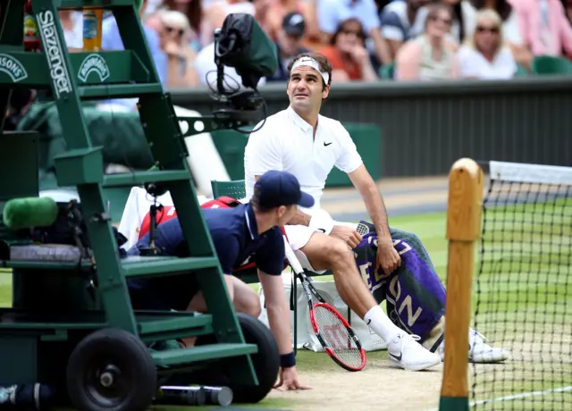 Roger Federer looks to the umpire