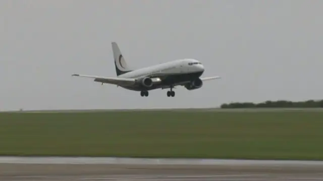 Wales plane touches down