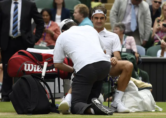 Roger Federer gets treatment