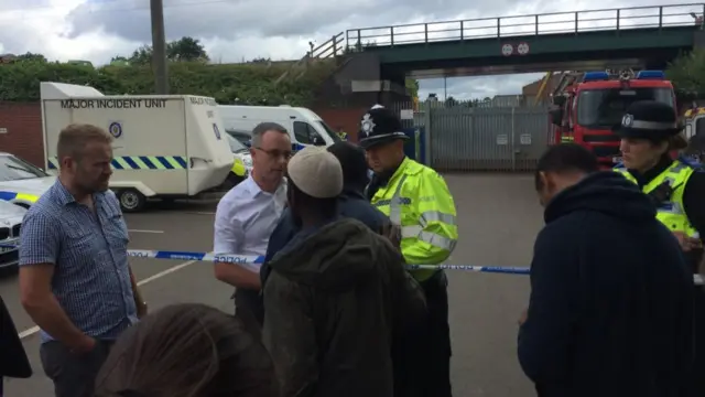 An emotional brother of one of the men who died in Nechells pleads with police officers to recover his body.