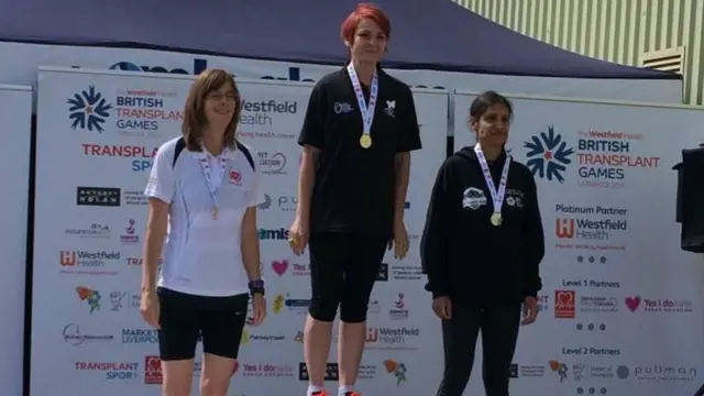 Sue Bennett, middle, receiving her 1,500m gold medal