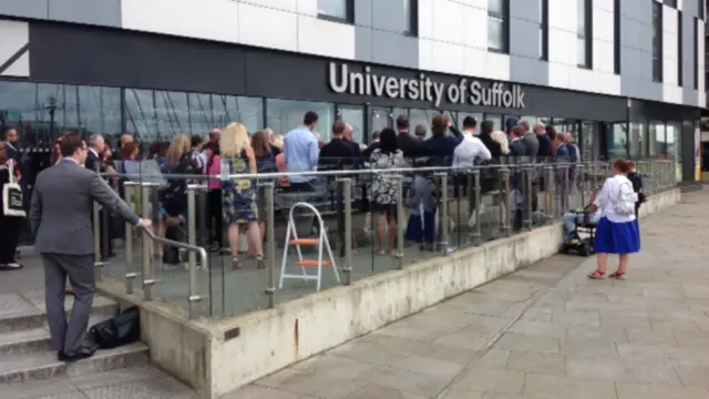 Crowd outside university prior to unveiling