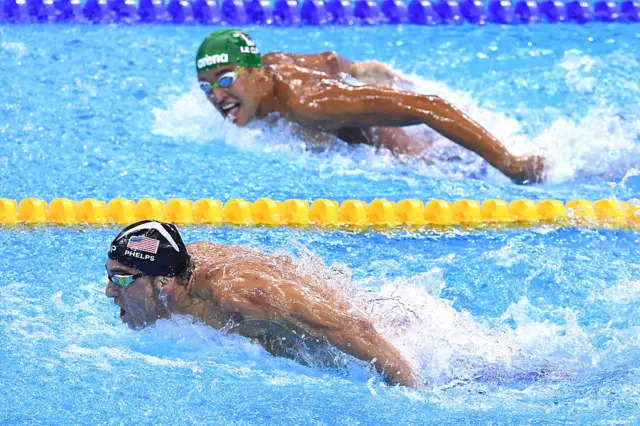 Michael Phelps (L) of the United States leads Chad le Clos of South Africa