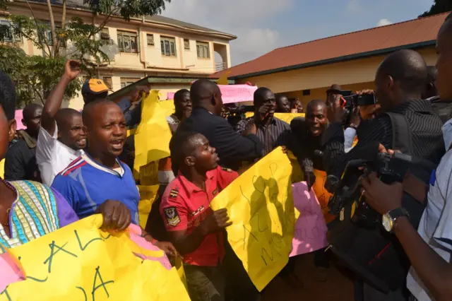 Gen Kale Kayihura's supporters outside a court in Kampala, Uganda