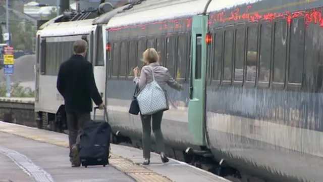 People about to get on a train