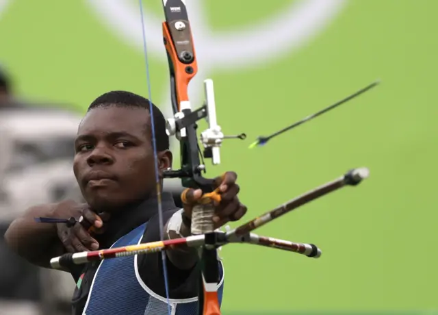 Malawi's Areneo David releases his arrow during an elimination round of the individual archery competition