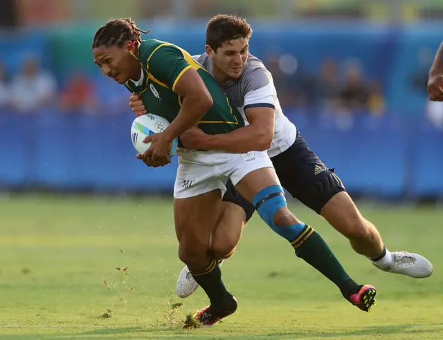 Justin Geduld of South Africa is tackled by Steeve Barry of France