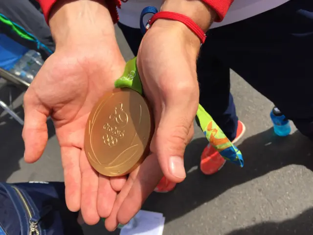 Joe Clarke hands and medal