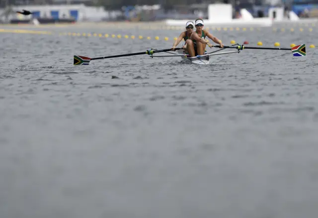 South Africa's Lee-Ann Persse (R) and South Africa's Kate Christowitz row during the Women's Pair rowing competition at the Lagoa stadium during the Rio 2016 Olympic Games in Rio de Janeiro on August 8, 2016.