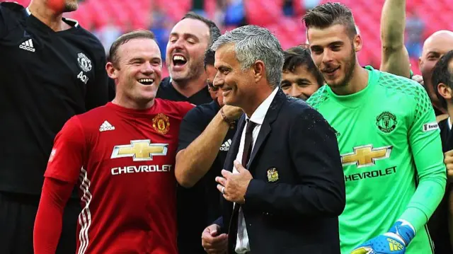 Jose Mourinho celebrates with his Manchester United players