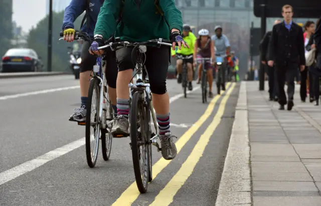 Cyclists on busy road