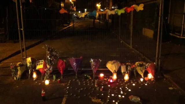 Candles and flowers were left in High Town Road in memory of the 15-year-old