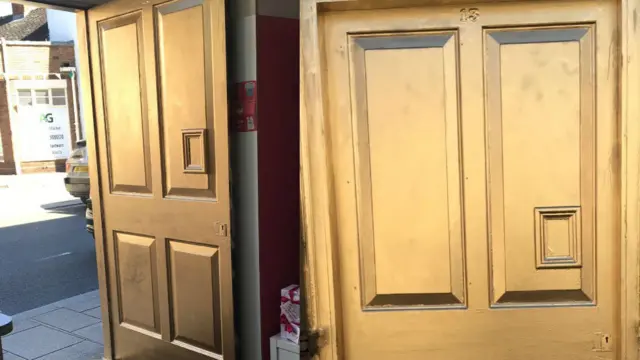 Uttoxeter Post Office's front door painted gold