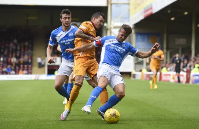 Motherwell's Marvin Johnson (centre) closes down Chris Millar