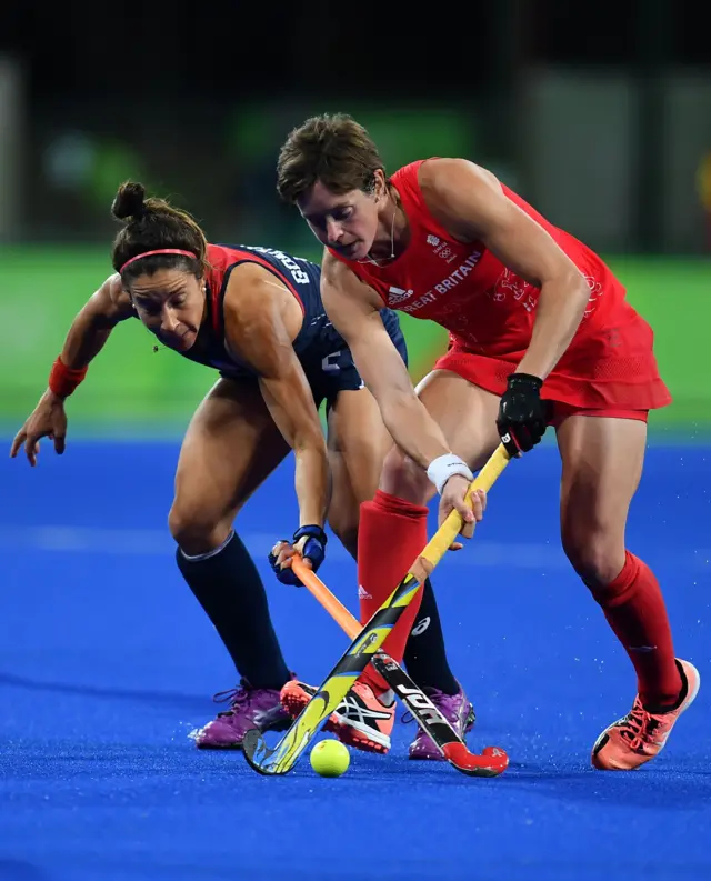 Teram GB's Hannah Macleod tackles an opponent in hockey