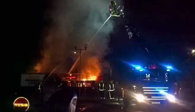 Firefighters tackle Burger King roof fire