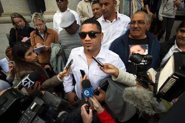 Morne Nurse(C) speaks to the medias outside the Cape Town High court