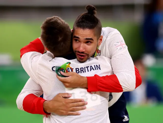 Louis Smith embraces team-mate Max Whitlock after the pommel event