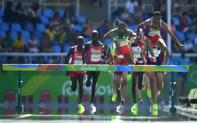 Eritrea's Yemane Haileselassie (R) compete in the Men's 3000m heats