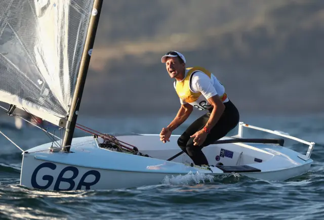 Giles Scott celebrates on his boat