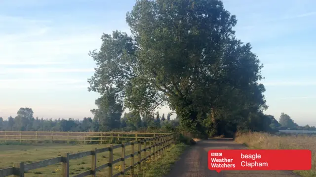 Blue skies over country track in Clapham