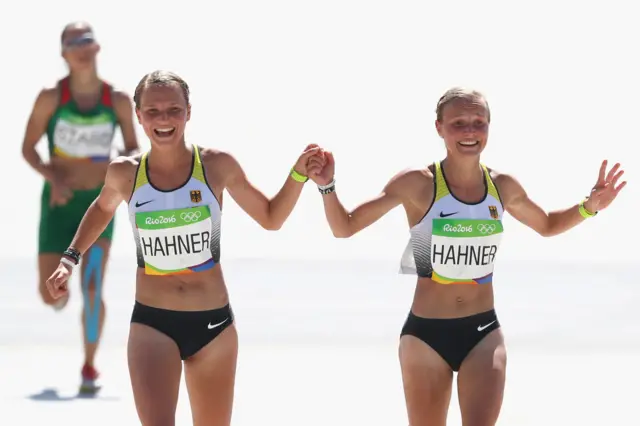 Lisa and Anna Hahner approach the finish line in the women's marathon