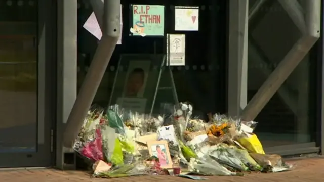 Flowers and tributes at All Saints Academy