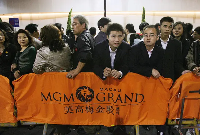 Crowds wait outside the MGM Grand in Macau