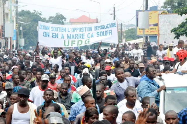 Protestors with banner reading "Support to opposition.