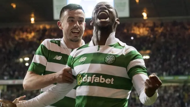 Moussa Dembele celebrates with Eoghan O'Connell after giving Celtic the lead against Astana