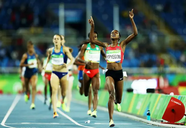 Faith Chepngetich Kipyegon of Kenya celebrates winning the gold medal in the 1500m race