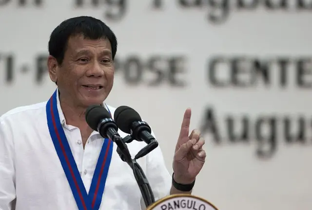 Philippines President Rodrigo Duterte gestures as he speaks in Manila