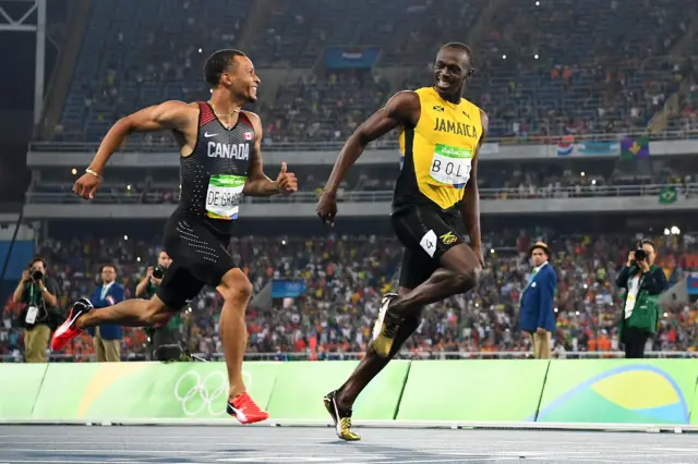 Andre de Grasse (left) and Usain Bolt